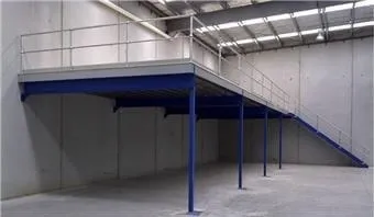 This picture shows a blue and silver coloured Mezzanine Floor with a staircase and guardrail.