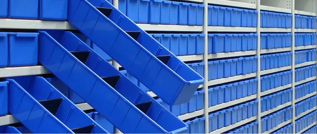 Opposing banks of blue Parts Trays fitted within Steel Shelving.