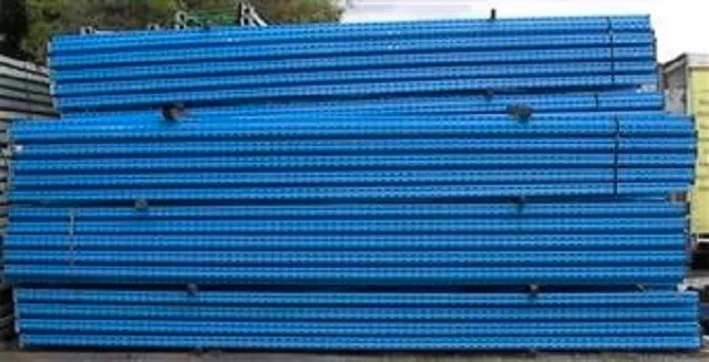 Blue coloured Used Pallet Racking End Frames in assembled form and stacked on top of one aother.