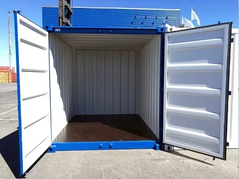 Blue shipping container with both doors open ready for ramp placement.