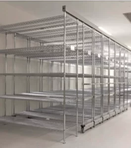 A longspan mobile shelving system with wire shelves.