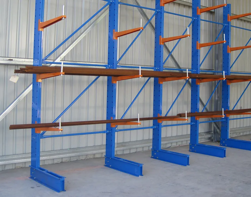 Blue and orange Cantilever Racking supporting reinforcing bars with Spigot pins fitted at arm ends.