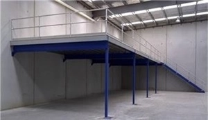 Here is a picture of a blue and silver-coloured structural mezzanine floor with a staircase and guardrail.