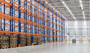 Industrial Racking with blue end frames and orange beams.